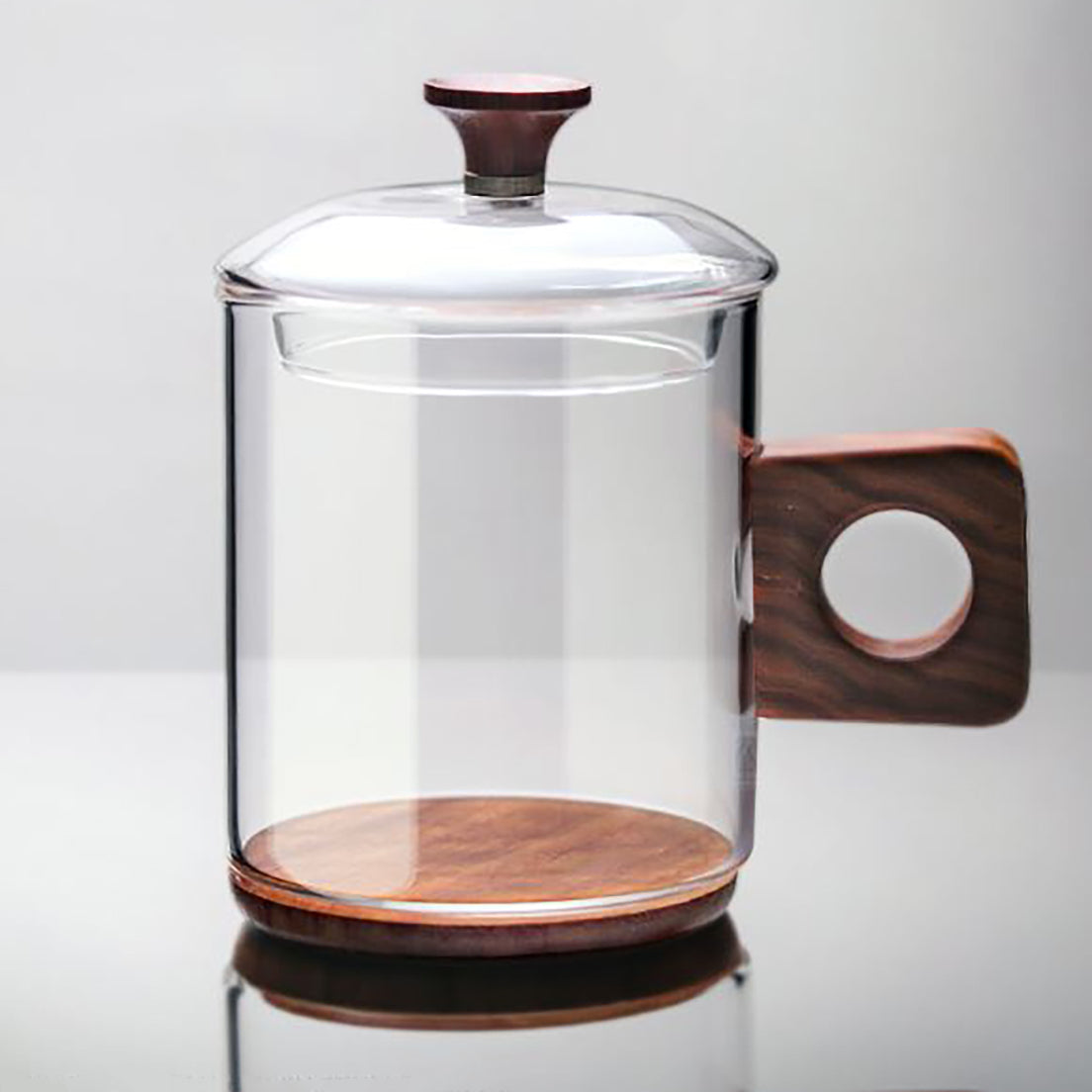 Drinking glass mug with wood bottom and handle